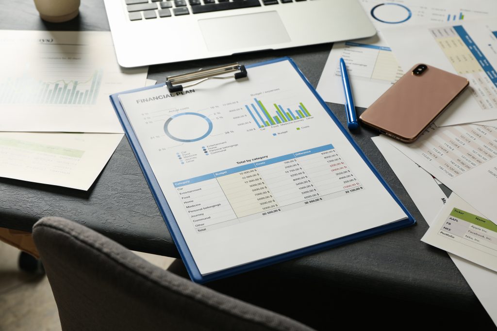 concept of financial planning on gray wooden table